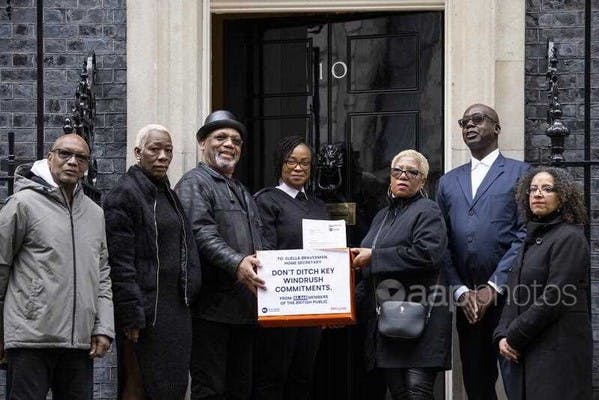 Campaigners hand in a petition, calling on the Home Secretary to honour recommendations given in a report about the Windrush scandal, April 6, 2023 (EPA/Tolga Akmen)