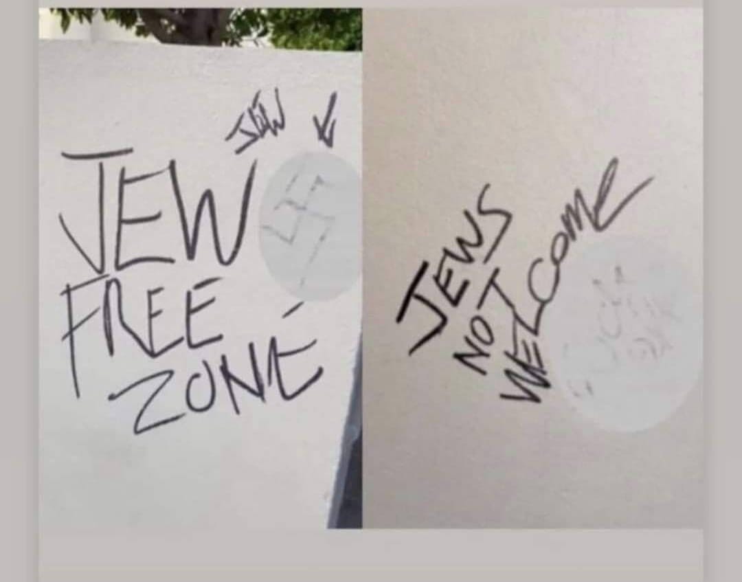 Antisemitic graffiti reading 'Jew Free Zone' and 'Jews Not Welcome'.