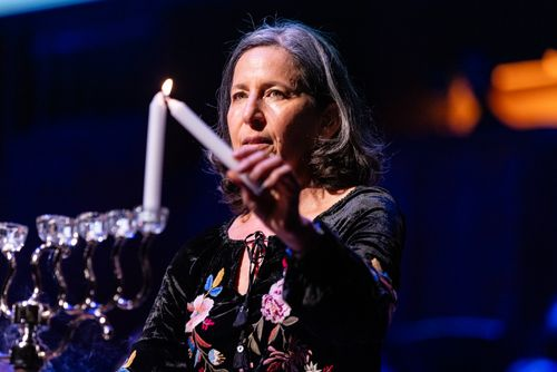 Woman lighting candle