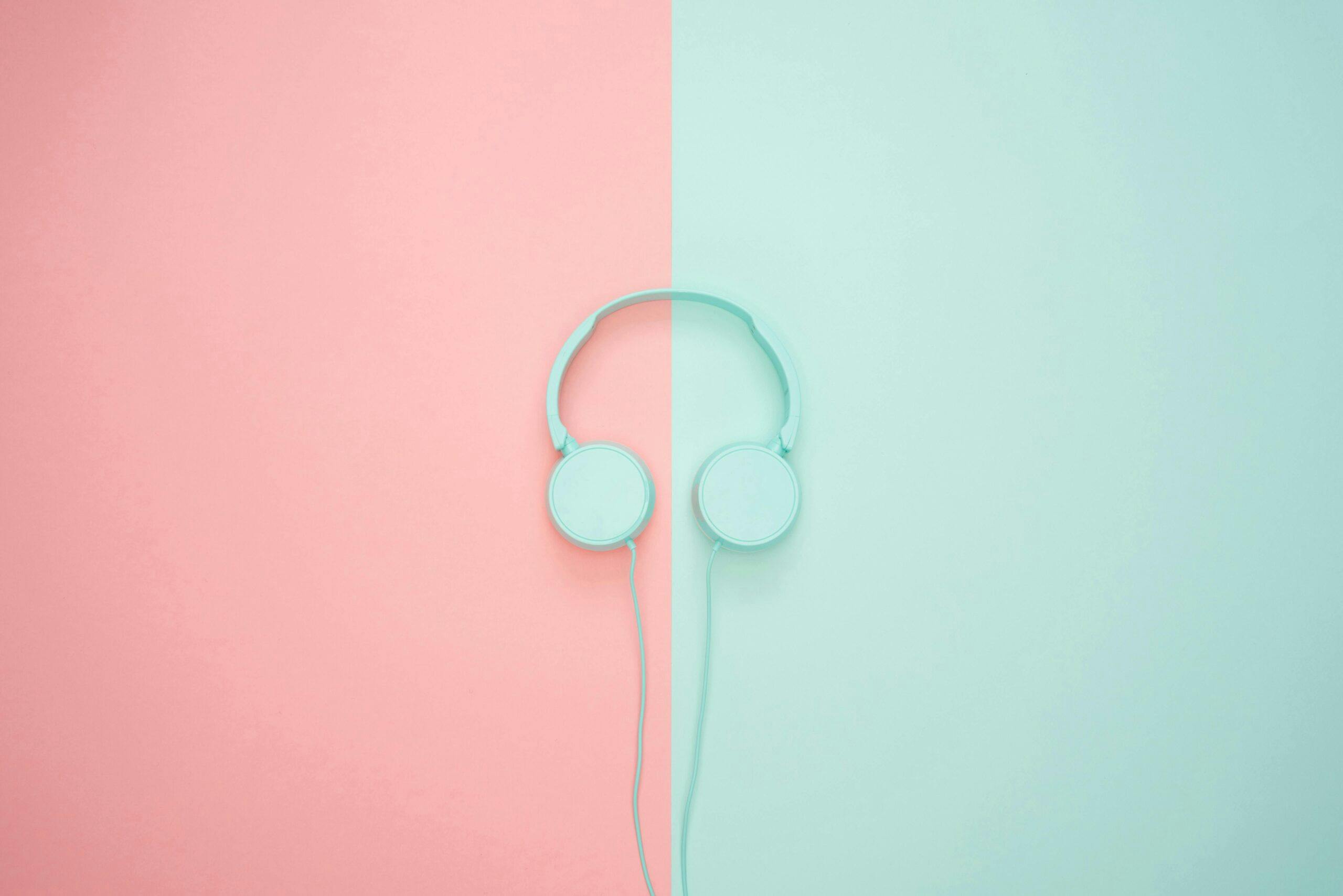green headphones on a pink and green background