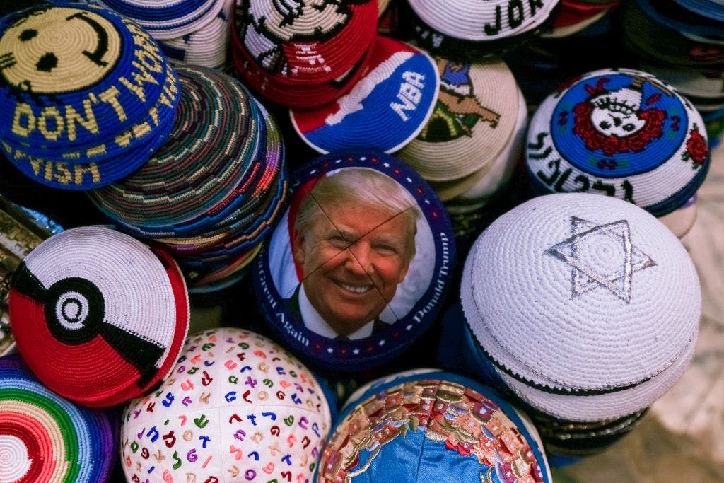 A yarmulke with a picture of Donald Trump, among many other yarmulkes of various colours and designs
