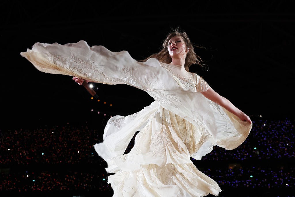 Woman dancing in white dress