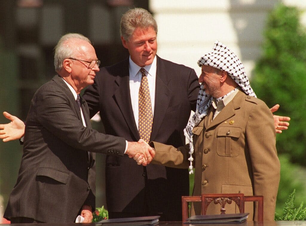 FILE--President Clinton, center, presides over ceremonies marking the signing of the 1993 peace accord between Israel and the Palestinians on the White House lawn with Israeli Prime Minister Yitzhak Rabin, left, and PLO chairman Yasser Arafat, right, in this Sept. 13, 1993, file photo. The parties that launched the historic Oslo peace accord in 1993 are set to meet in the Norwegian capital the first week in Nov. 1999, to commemorate its successes, make sense of its failures and, hopefully, to spur thehobbled process forward. (AP Photo/Ron Edmonds, File)