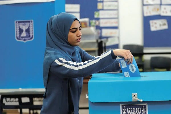 An Arab Israeli woman votes in the 2021 election in March