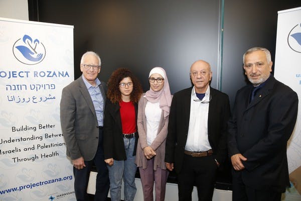 Ron Finkel (left) and Dr Jamal Rifi (right) with members of Aiia Marssarwe's family at the launch of the medical scholarship in her name, October 2019