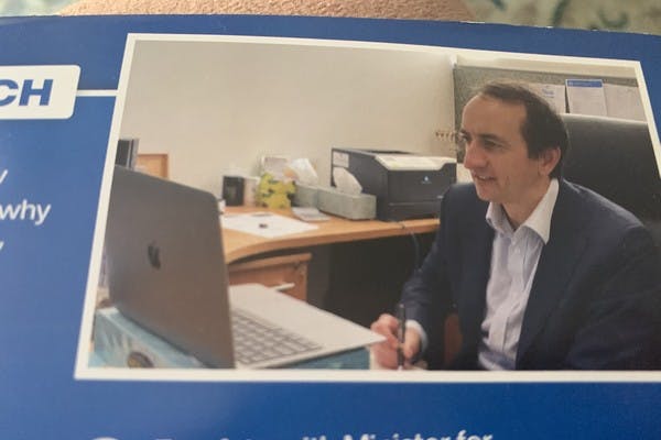 Dave Sharma publicity brochure, with a menorah in the background 