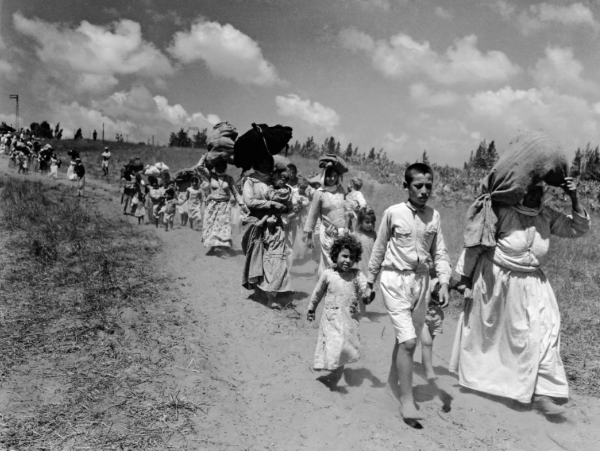 Palestinians leave their homes near Haifa in 1948