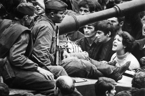 Czech protesters confront Soviet soldiers in Prague in 1968